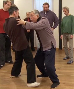 William C.C. Chen demonstrating push hands technique