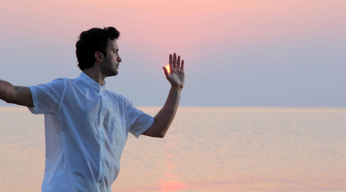 Practicing Tai Chi Chuan peacefully on the beach